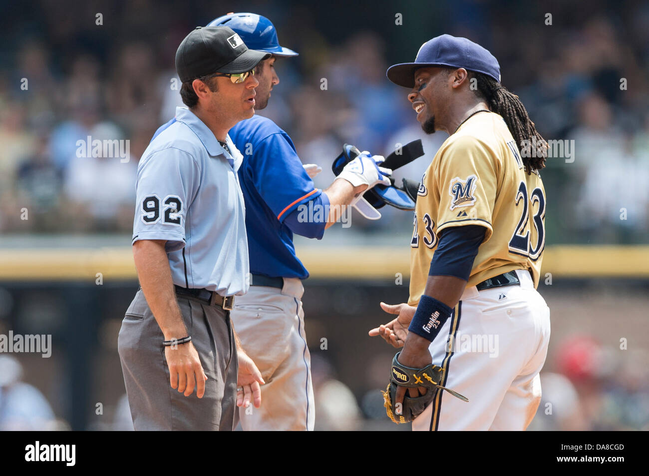 Milwaukee, Wisconsin, USA. 7th July, 2013. July 7, 2013: Milwaukee Brewers second baseman Rickie Weeks #23 discusses a call by umpire John Hirschbeck during the Major League Baseball game between the Milwaukee Brewers and the New York Mets at Miller Park in Milwaukee, WI. Mets win 2-1. John Fisher/CSM. Credit:  csm/Alamy Live News Stock Photo