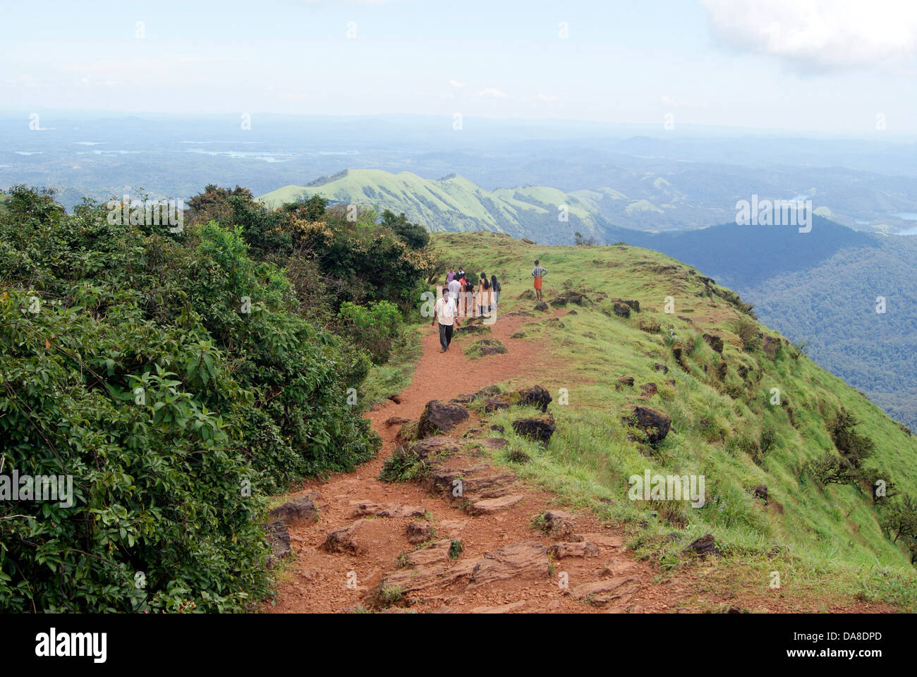 Western ghats India Mountain top and Pilgrims going through Lush Green Kodachadri Hills to visit Sarvajnapeedam Mandapam Stock Photo