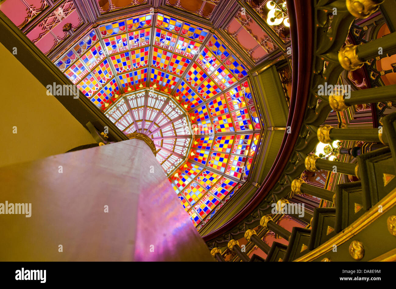 Louisiana, Baton Rouge. Historic old State Capitol Building. Interior spiral stairway and ornate stained glass ceiling window. Stock Photo