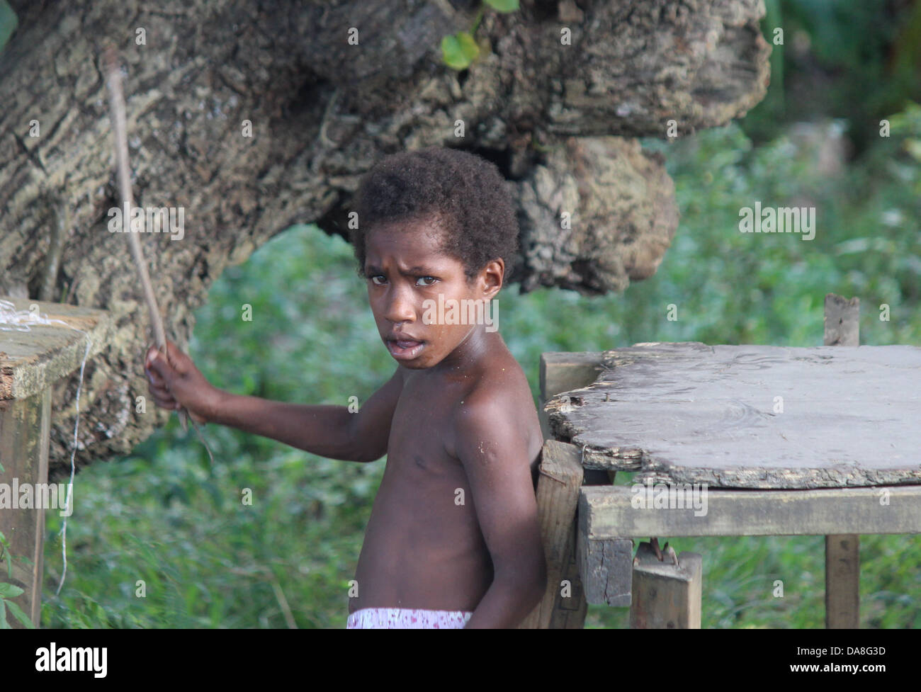 island boy with stick Stock Photo - Alamy