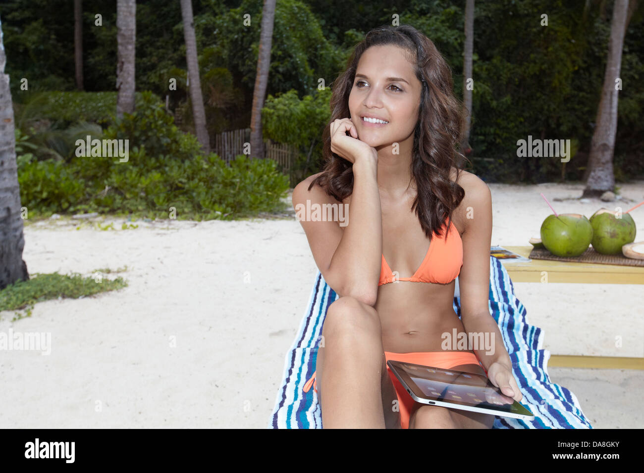 A woman relaxing on a beach. Stock Photo