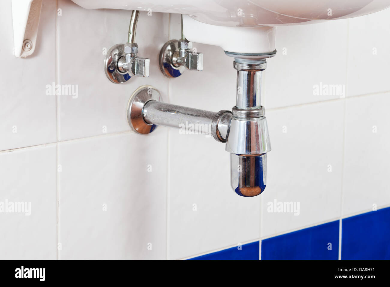 metal sink siphon and drain closed up Stock Photo
