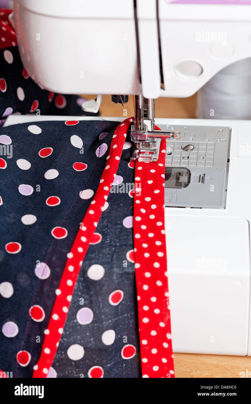 sewing dress on sewing machine close up Stock Photo Alamy