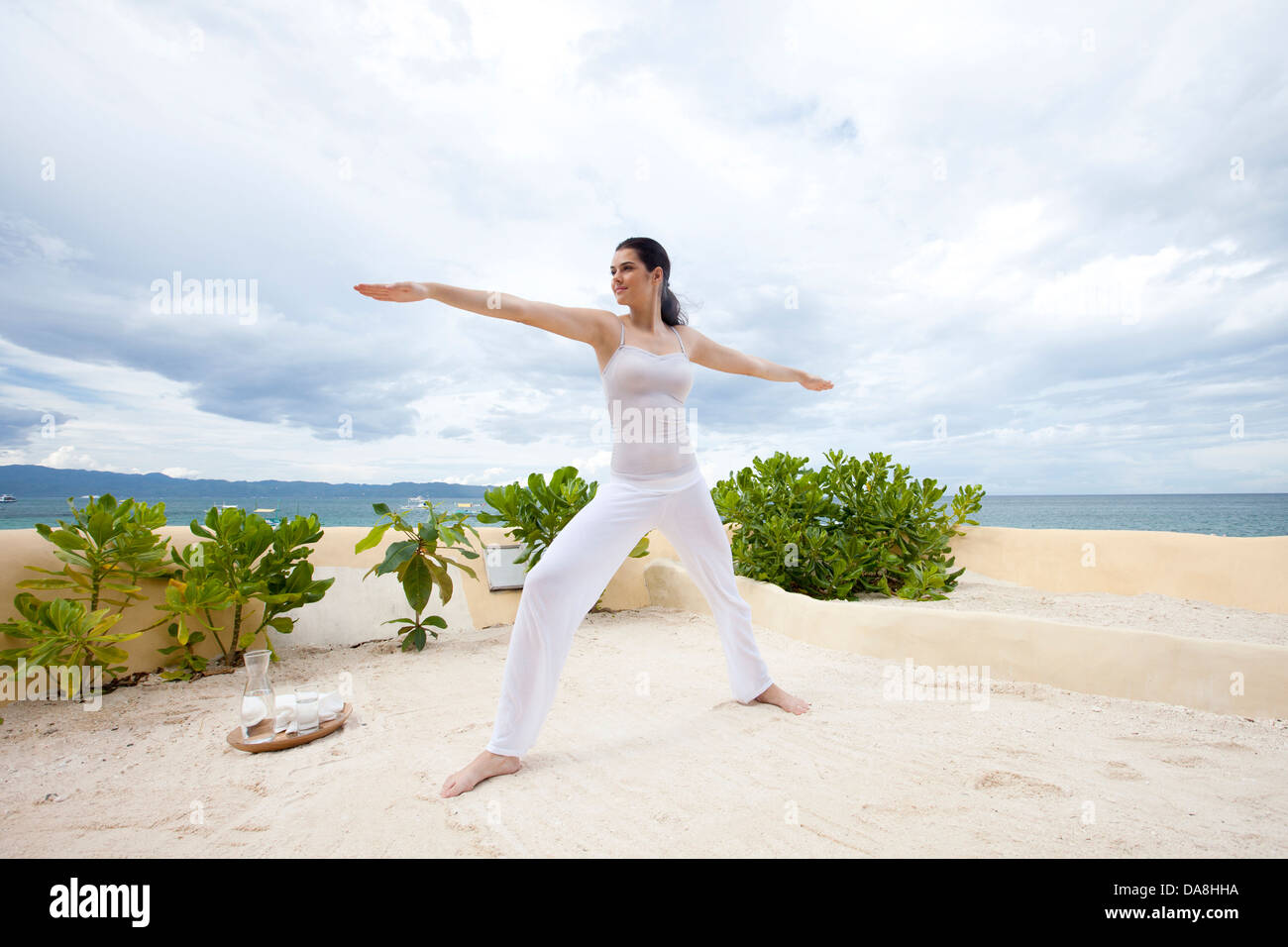 A young woman practicing yoga Stock Photo - Alamy