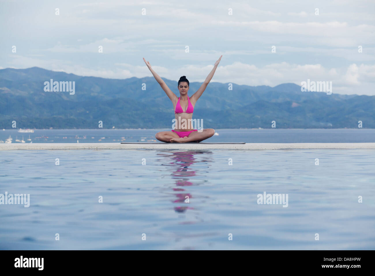 A young woman practicing yoga. Stock Photo