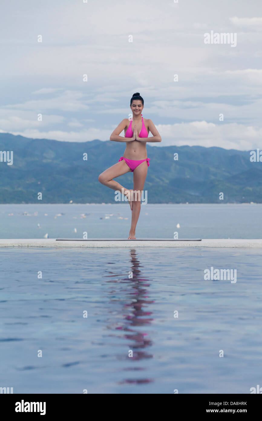 A young woman practicing yoga. Stock Photo