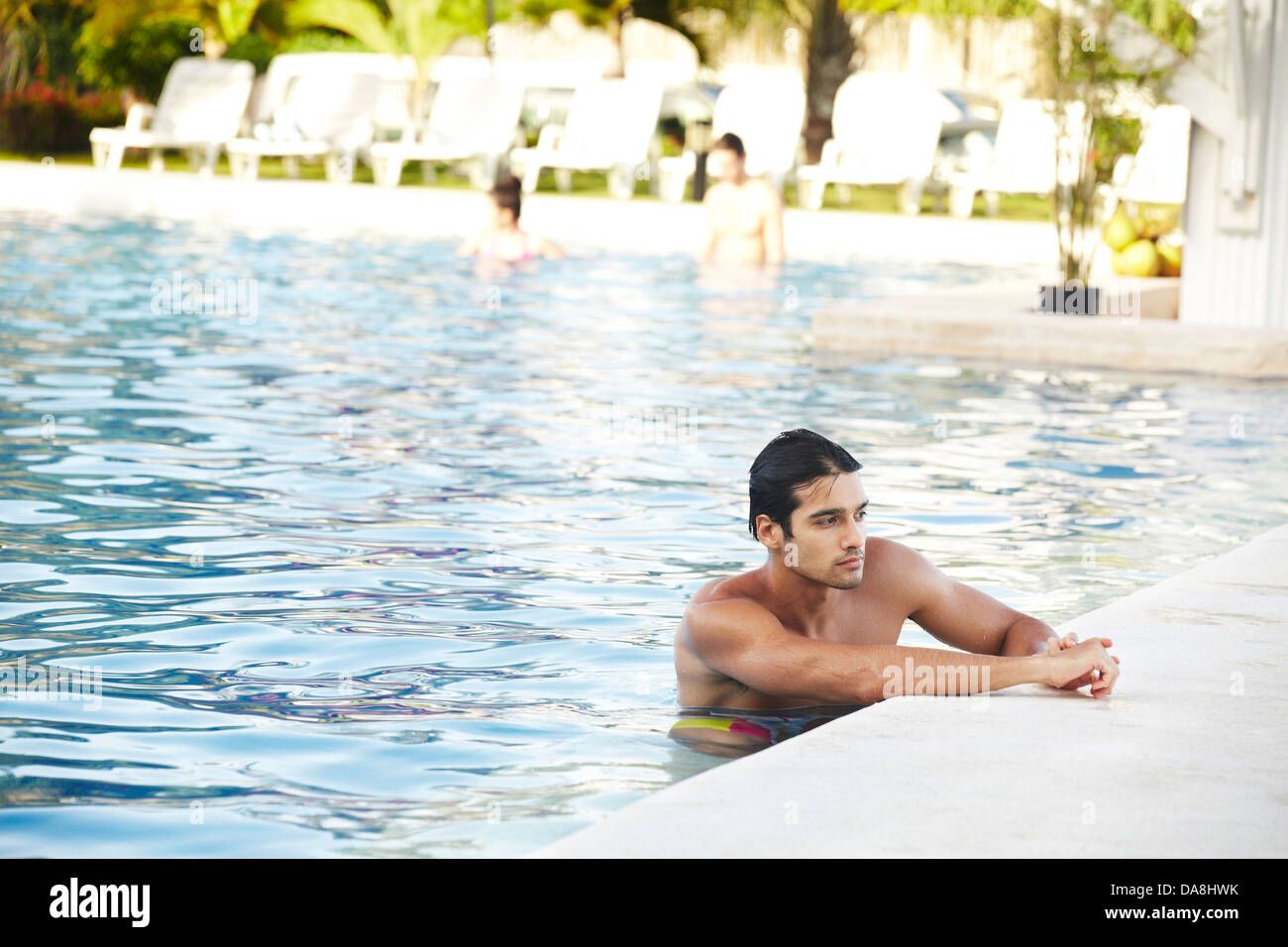 A man relaxing poolside. Stock Photo