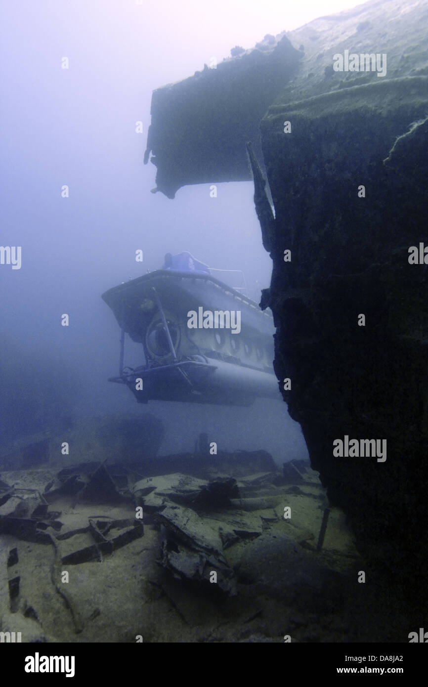 Submarine exploring a shipwreck Stock Photo