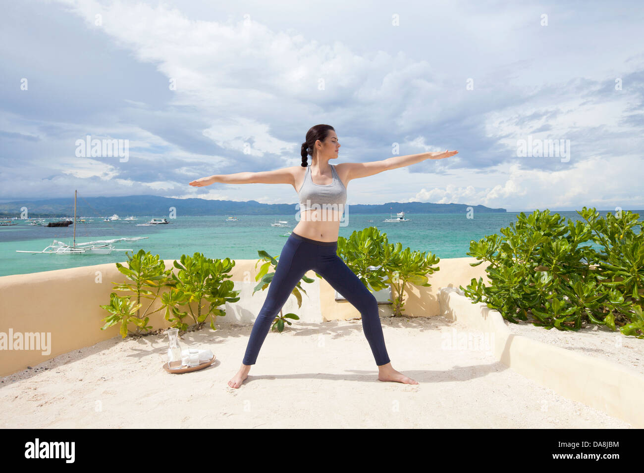 A young woman practicing yoga. Stock Photo
