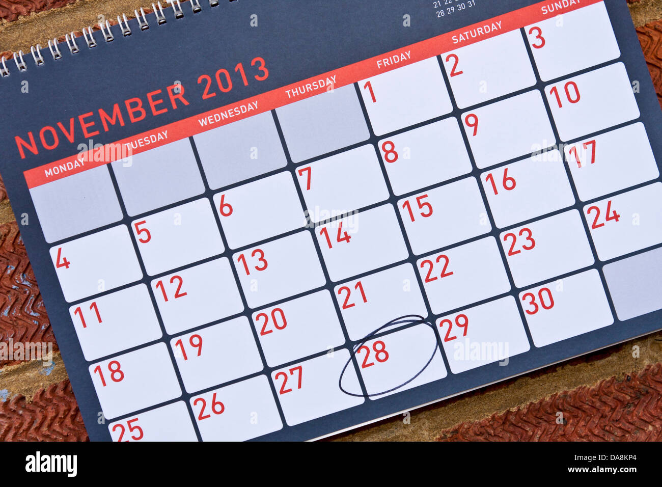 Monthly calendar hung on a wall with Thursday 28th November circled - Thanksgiving in the USA, 2013 Stock Photo