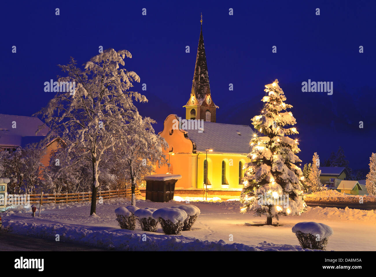 Austria, Europe, Tyrol, Mieminger plateau, Obsteig, church, tree, Christmas tree, trees, snow, winter, Christmas mood, lights, b Stock Photo