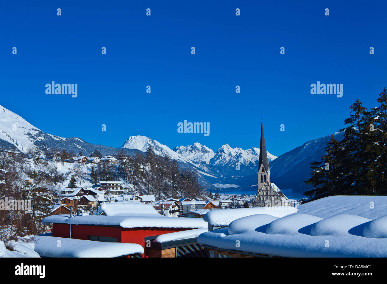 Austria, Europe, Tyrol, Oberinntal, Imst, district capital, winter, snow, church, houses, homes, mountains, Gurgltal, Mieminger Stock Photo