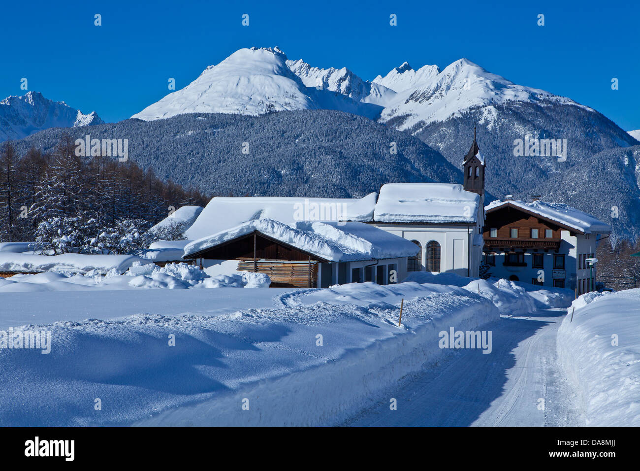 Austria, Europe, Tyrol, Mieminger plateau, Obsteig, Holzleiten, chapel, snow, winter, snowy face, wood, forest, mountains, Lecht Stock Photo