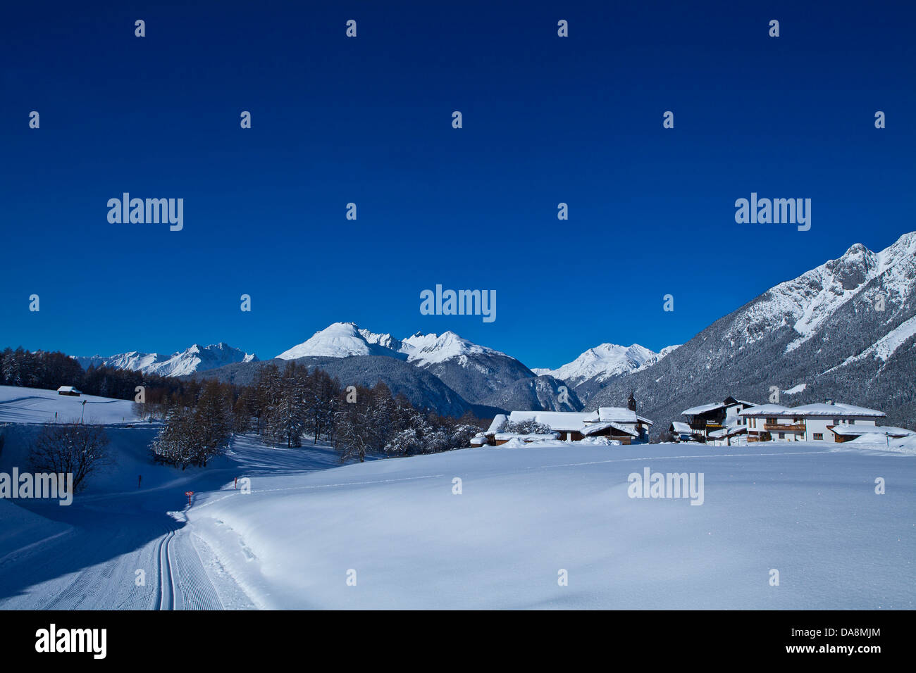 Austria, Europe, Tyrol, Mieminger plateau, Obsteig, Holzleiten, winter, snow, houses, homes, mountains, panorama, cross-country Stock Photo