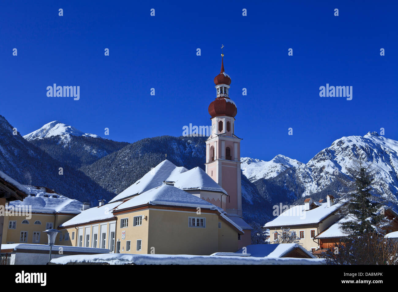 Austria, Europe, Tyrol, Gurgltal, Nassereith, winter, church, snow, sky, mountains, Lechtal, Lech valley, Alps, sky, blue, white Stock Photo