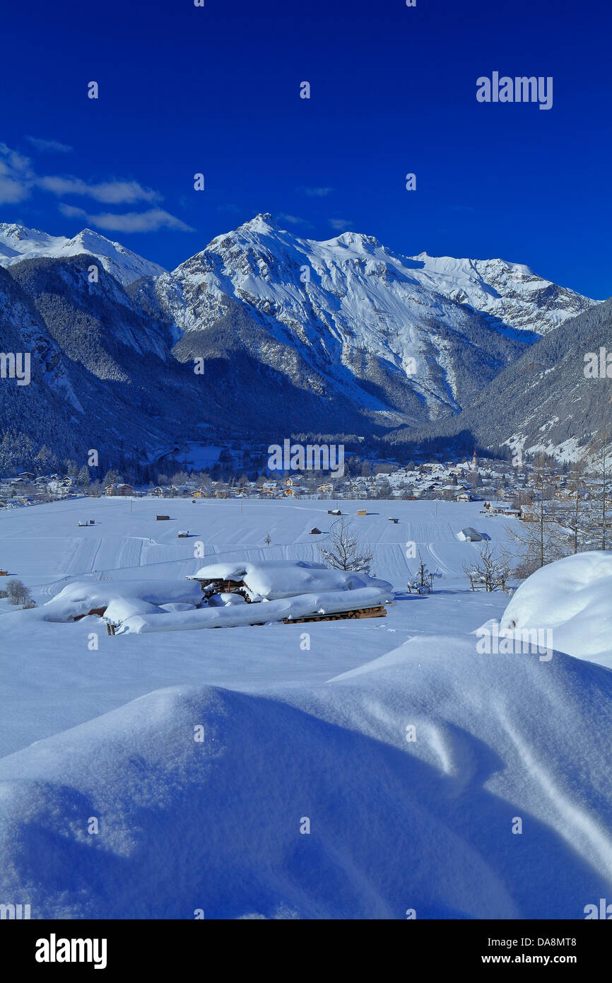 Austria, Europe, Tyrol, Gurgltal, Nassereith, winter, snow, place, mountains, Lechtal, Lech valley, Alps, Loreakopf, wood, fores Stock Photo