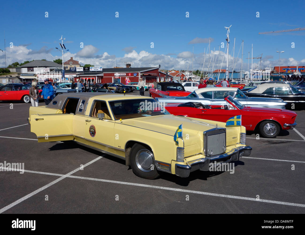78 Lincoln Town Car Limousine decorated with Swedish flags on a car park. Bohuslan, Sweden Stock Photo