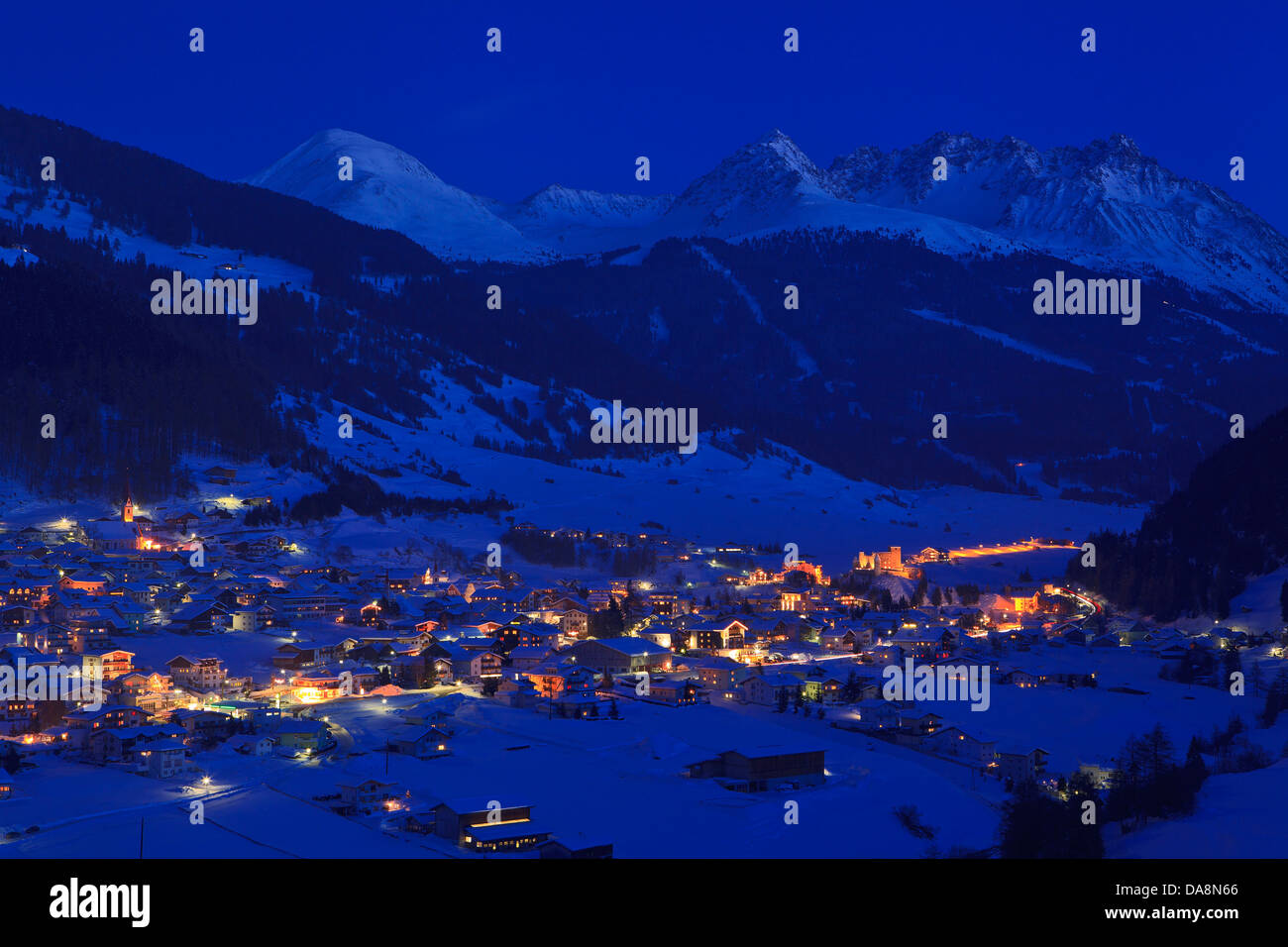 Austria, Europe, Tyrol, Oberinntal, Nauders, Oberes Gericht, Reschenpass, winter, evening, dusk, twilight, night, lights, touris Stock Photo