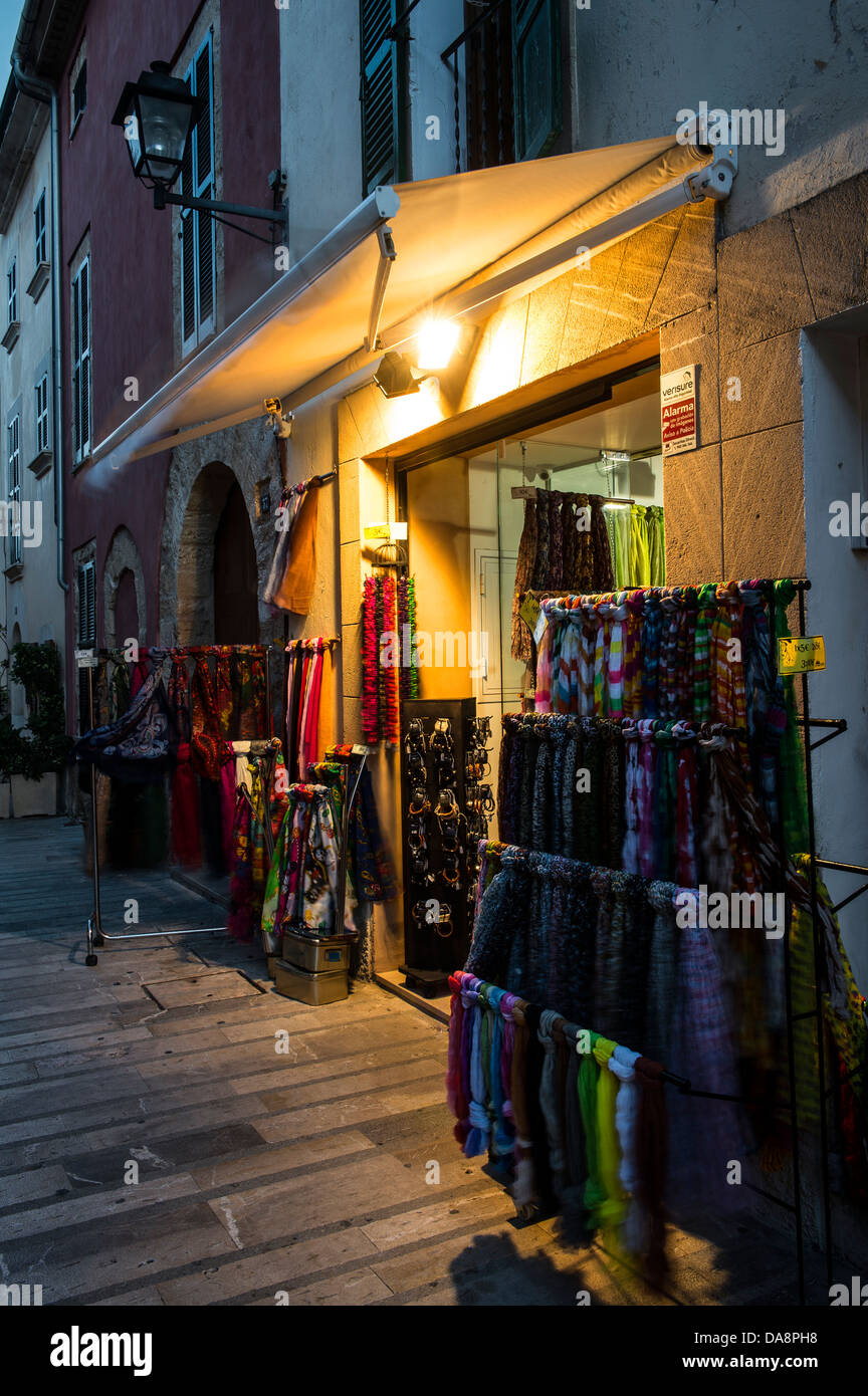 Shops in the old town of Alcudia, Mallorca at dusk Stock Photo Alamy