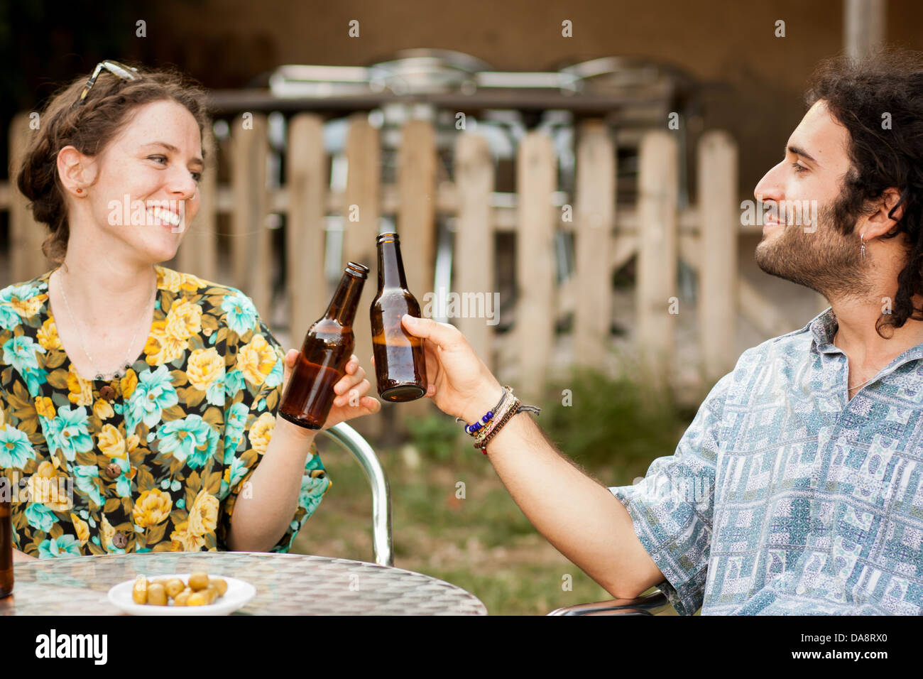 Couple of friends making a toast in a terrace outdoors Stock Photo