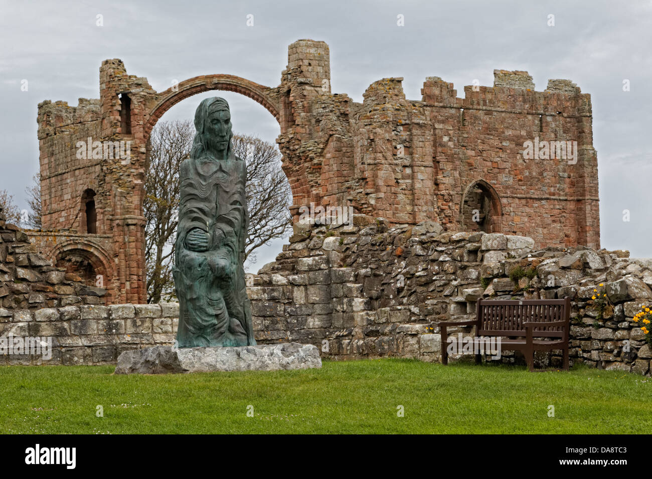 Sculpture of Cuthbert of Farne by Fenwick Lawson at Lindisfarne Priory Stock Photo