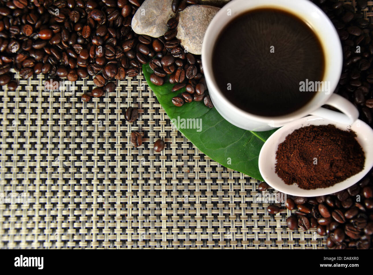 cup of coffee on various coffee beans ground coffee and next Stock