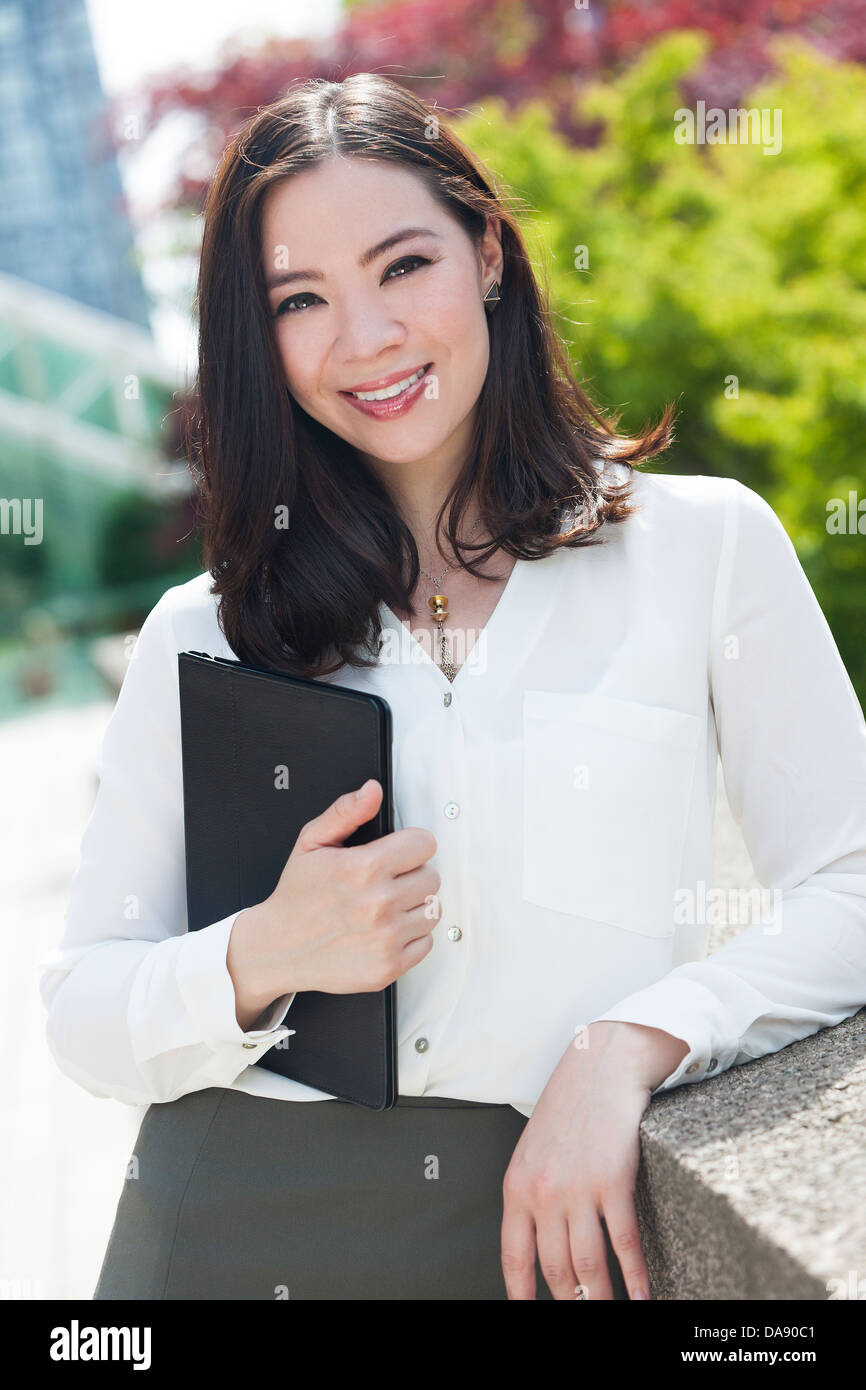 Portrait of a young Asian woman, lawyer or businesswoman smiling at a