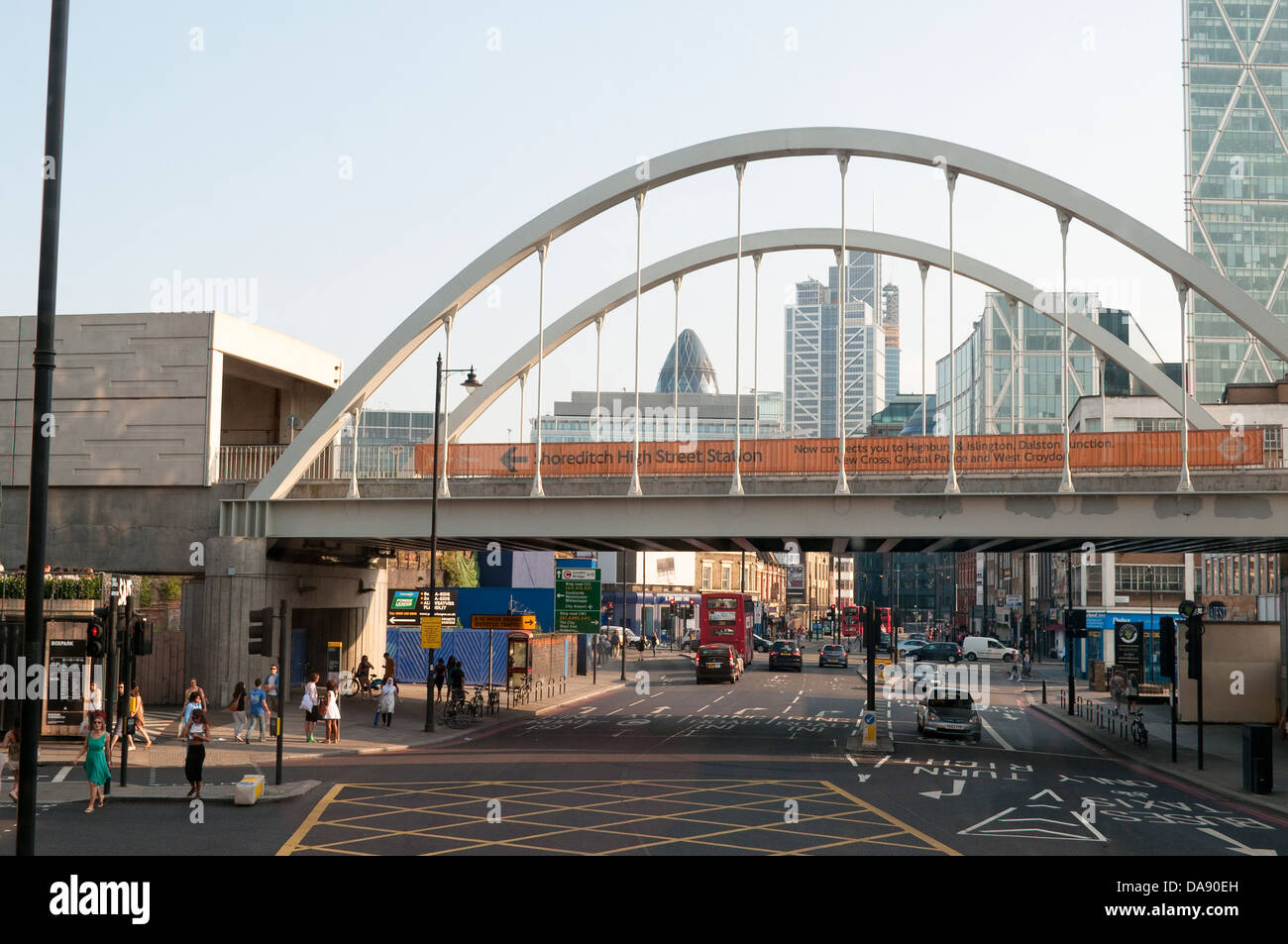 Shoreditch High Street with railway bridge and City of London in distance, East London, Uk Stock Photo