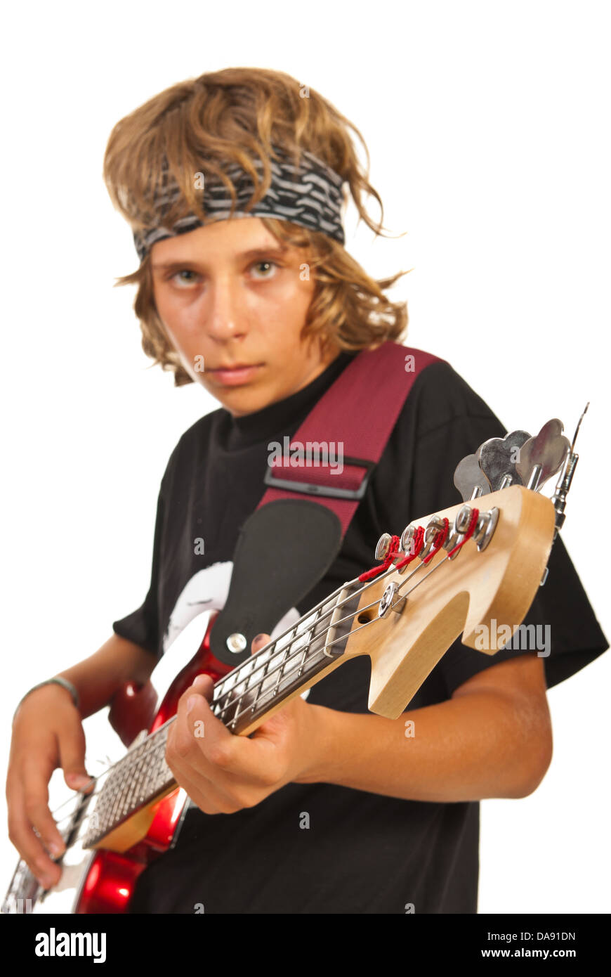 Teen boy playing bass guitar isolated on white background Stock Photo