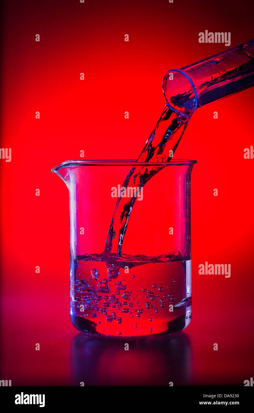 Glass Beaker In Lab Pouring Liquid Chemicals Into Beakers Stock Photo