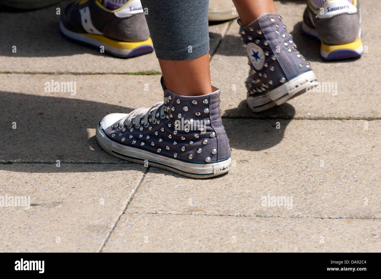 Girl wearing Converse baseball boots Stock Photo - Alamy