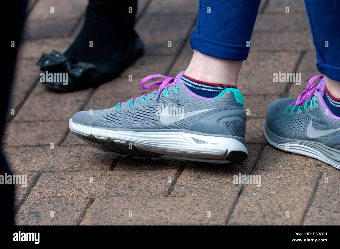 Teenage girl wearing Nike trainers Stock Photo - Alamy