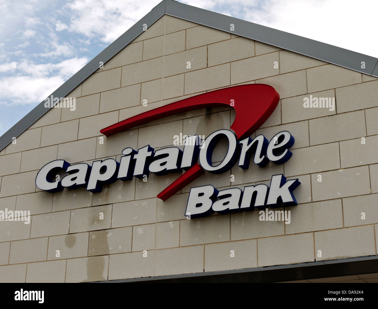 The capital one sign and loan on the the front of their bank building. Stock Photo