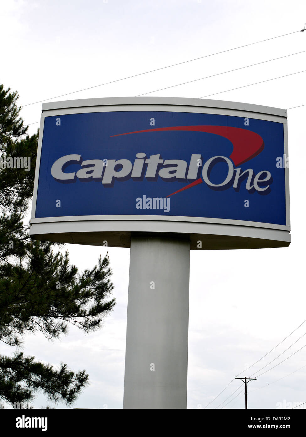 A tall Capital One sign with Capital Ones logo Stock Photo
