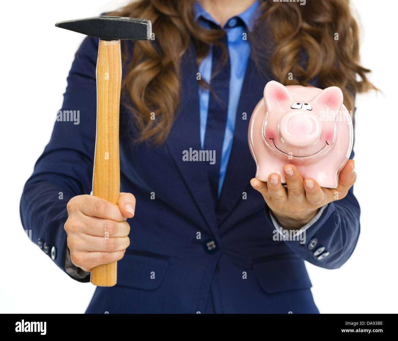 Closeup on business woman giving piggy bank and hammer Stock Photo - Alamy