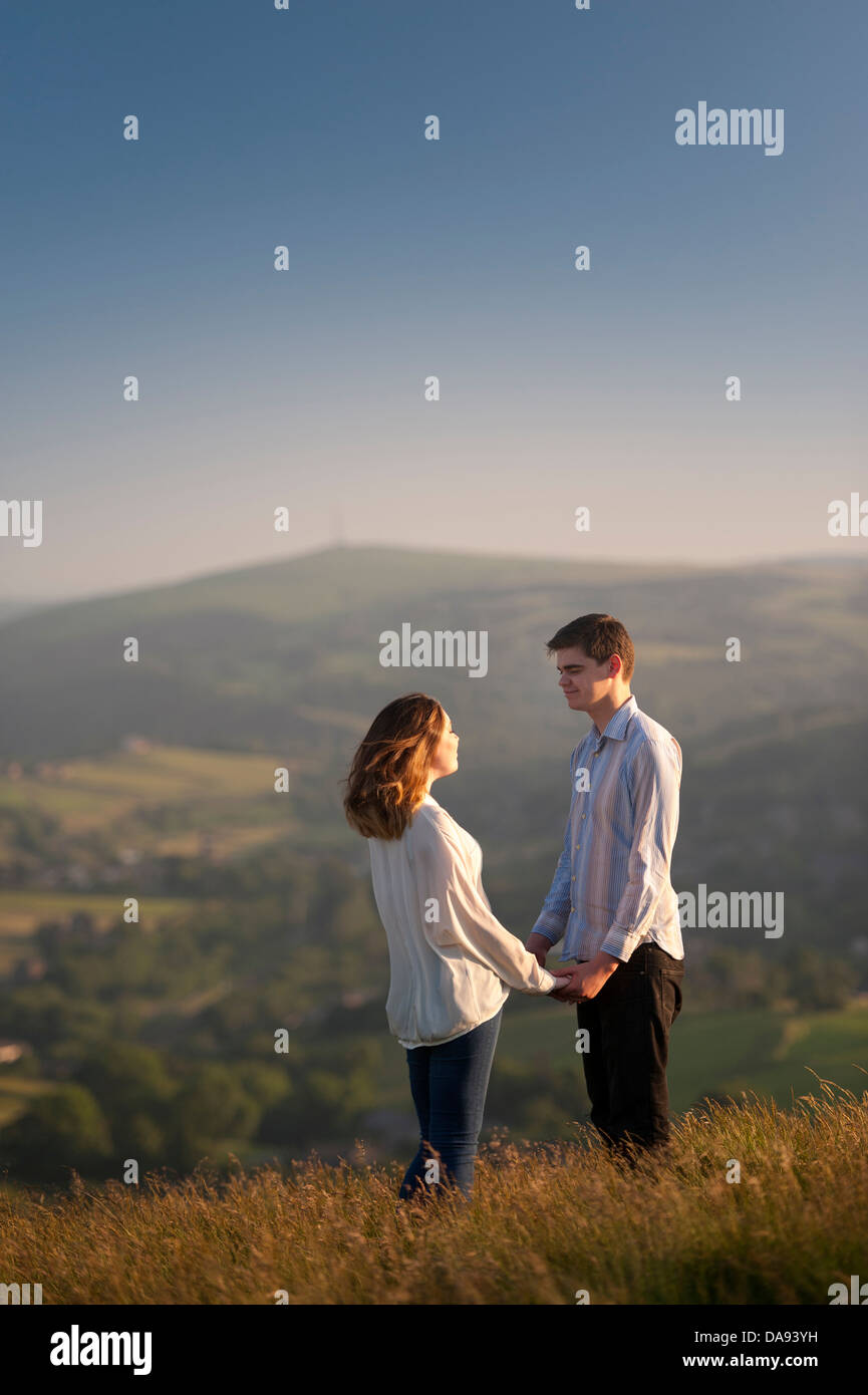 romantic young couple holding hands on a hillside in saddleworth yorkshire england uk Stock Photo