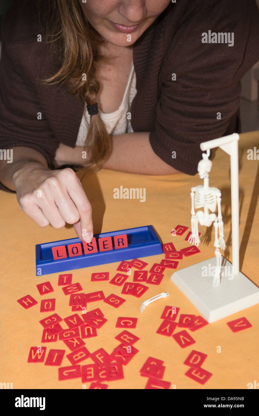 Woman playing Hangman board game Stock Photo Alamy