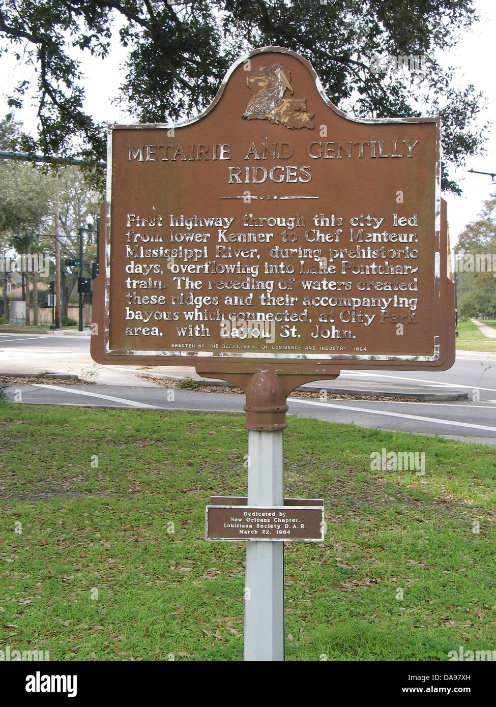 METAIRIE AND GENTILLY RIDGES First highway through this city led from lower Kenner to Chef Menteur, Mississippi River, during prehistoric days, overflowing into Lake Pontchartrain. The receding of waters created these ridges and their accompanying bayous which connected, at City Park area, with bayou St. John. Erected by the Department of Commerce and Industry, 1964. Dedicated by New Orleans Chapter, Louisiana Society D.A.R. March 22, 1964. Stock Photo