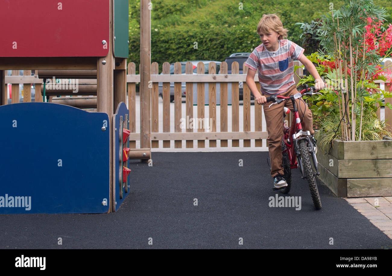 young white boy playing in playground Stock Photo - Alamy