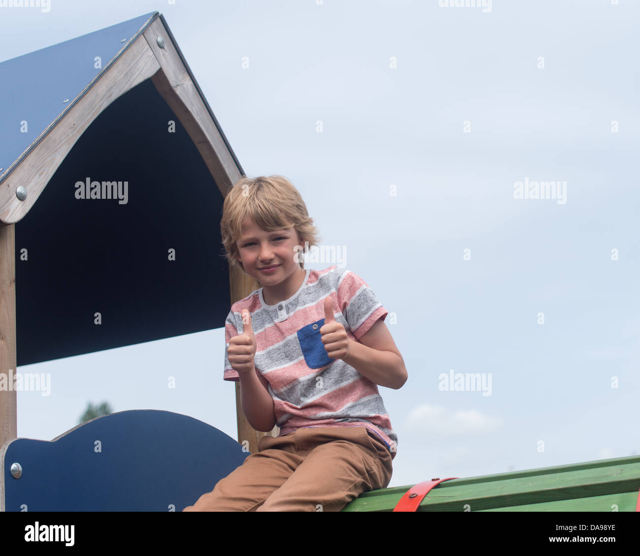 young white boy playing in playground Stock Photo - Alamy