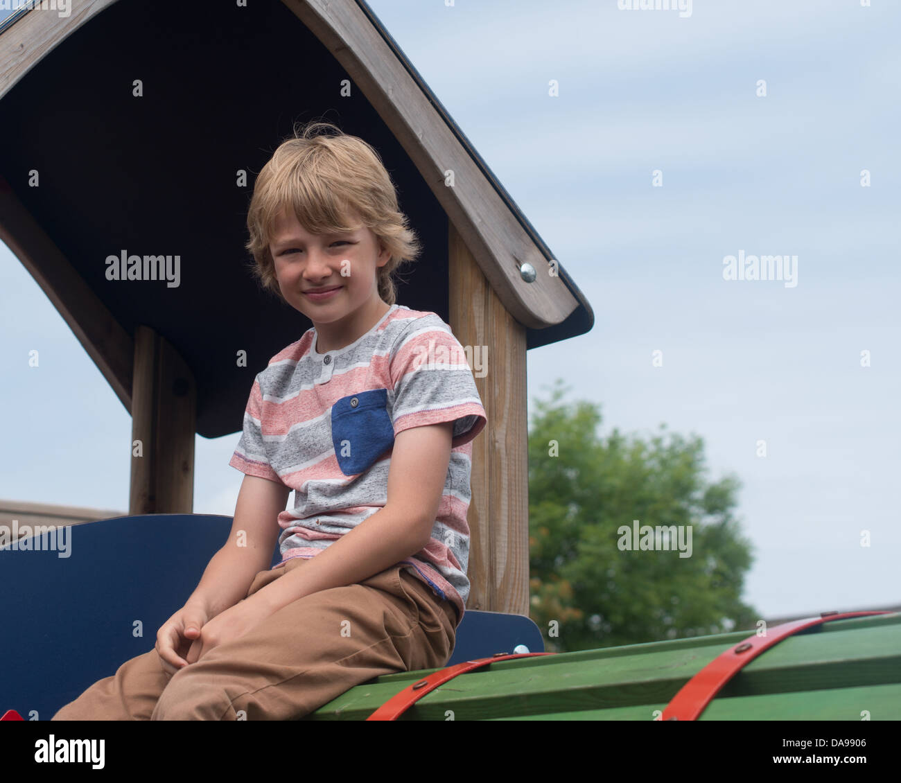 Boy playing at playground hi-res stock photography and images - Alamy