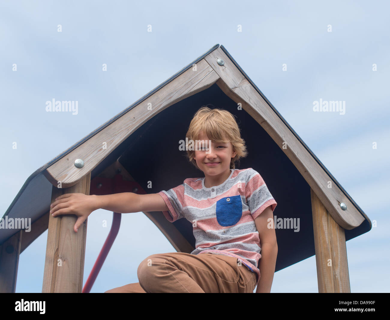 young white boy playing in playground Stock Photo - Alamy