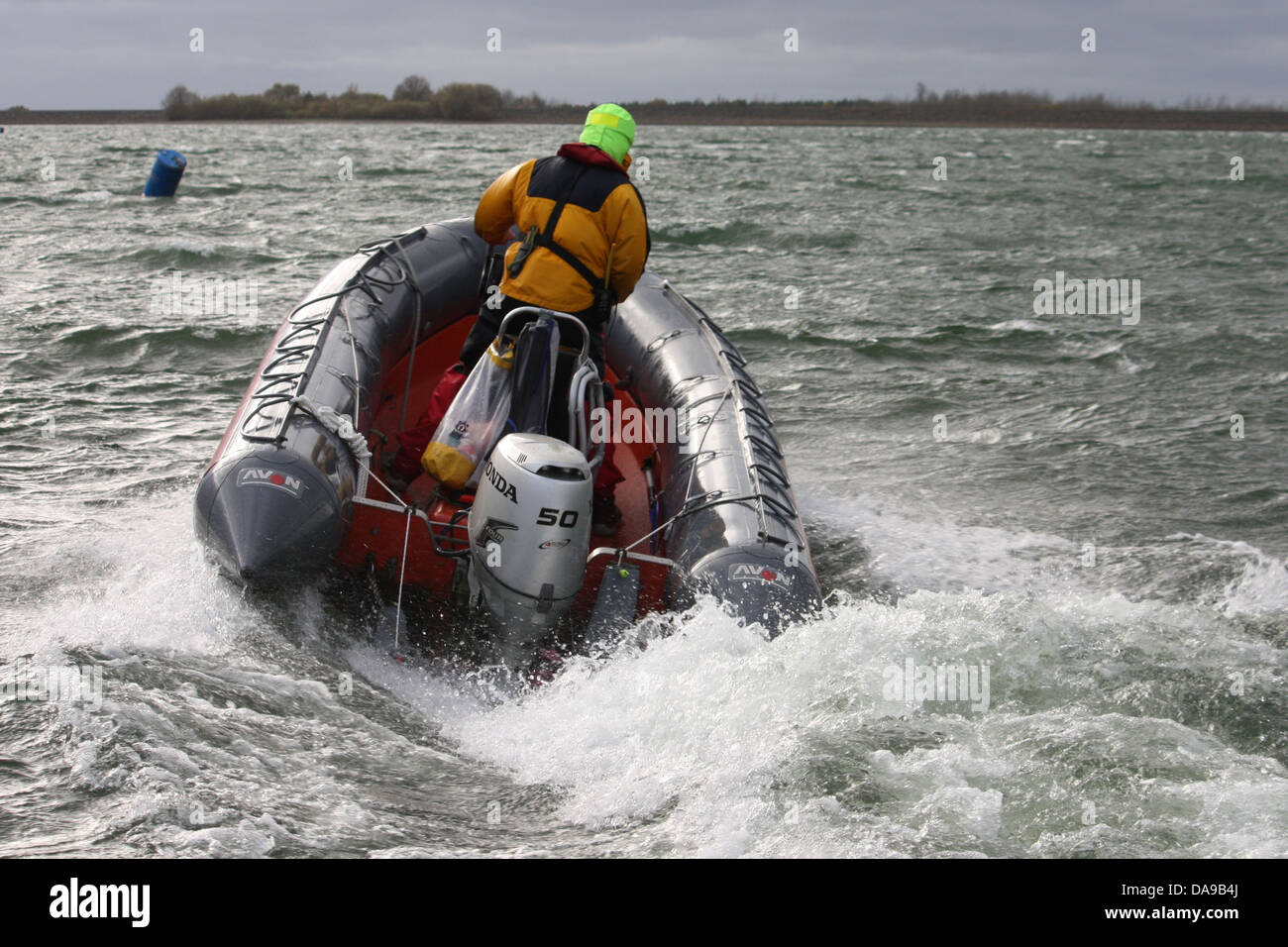A rigid inflatable boat RIB powering through waves Stock Photo