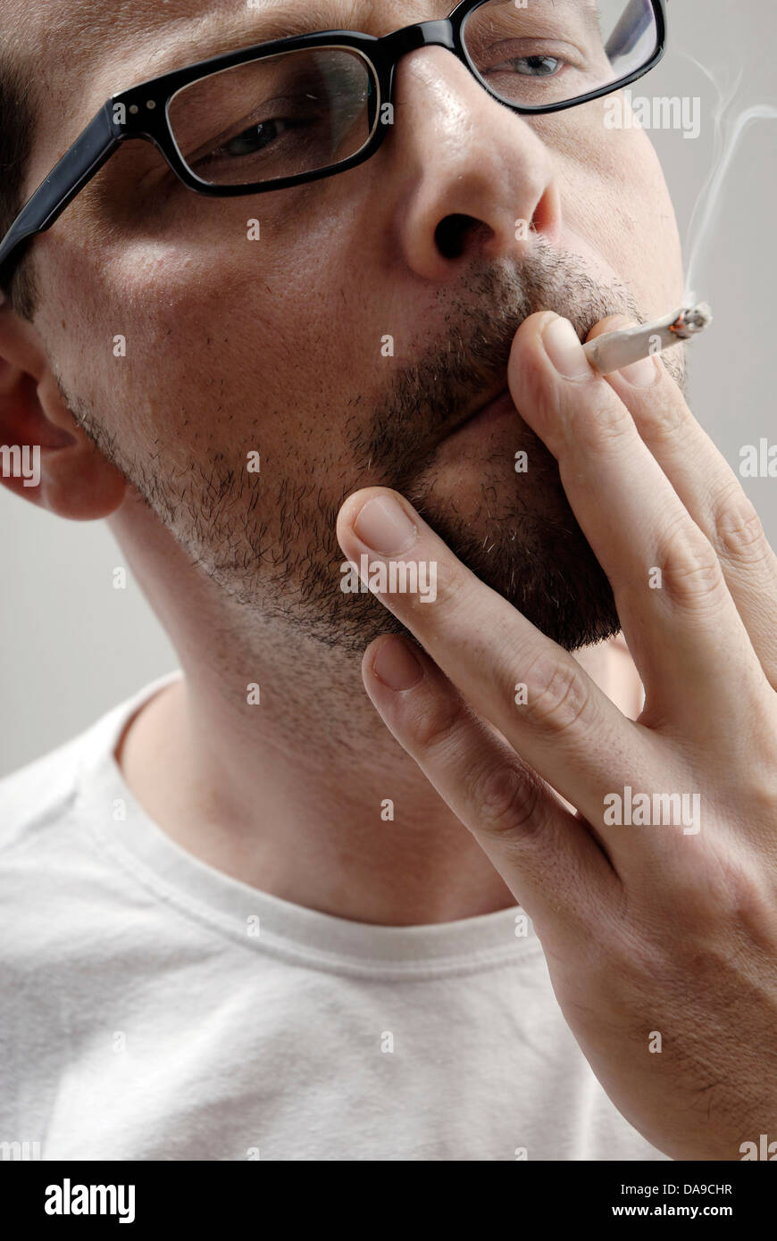 Man smoking a cigarette Stock Photo