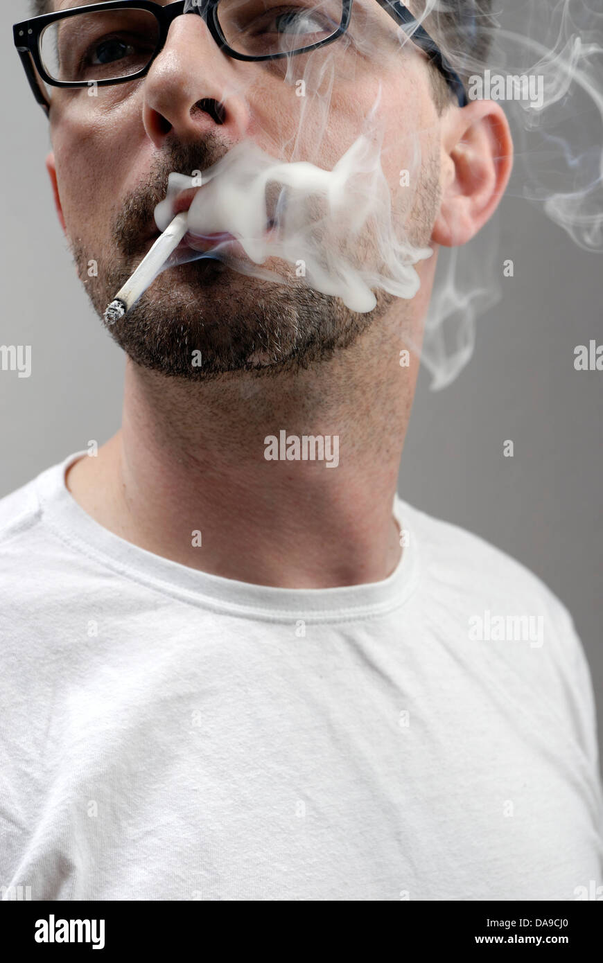 Man smoking a cigarette Stock Photo