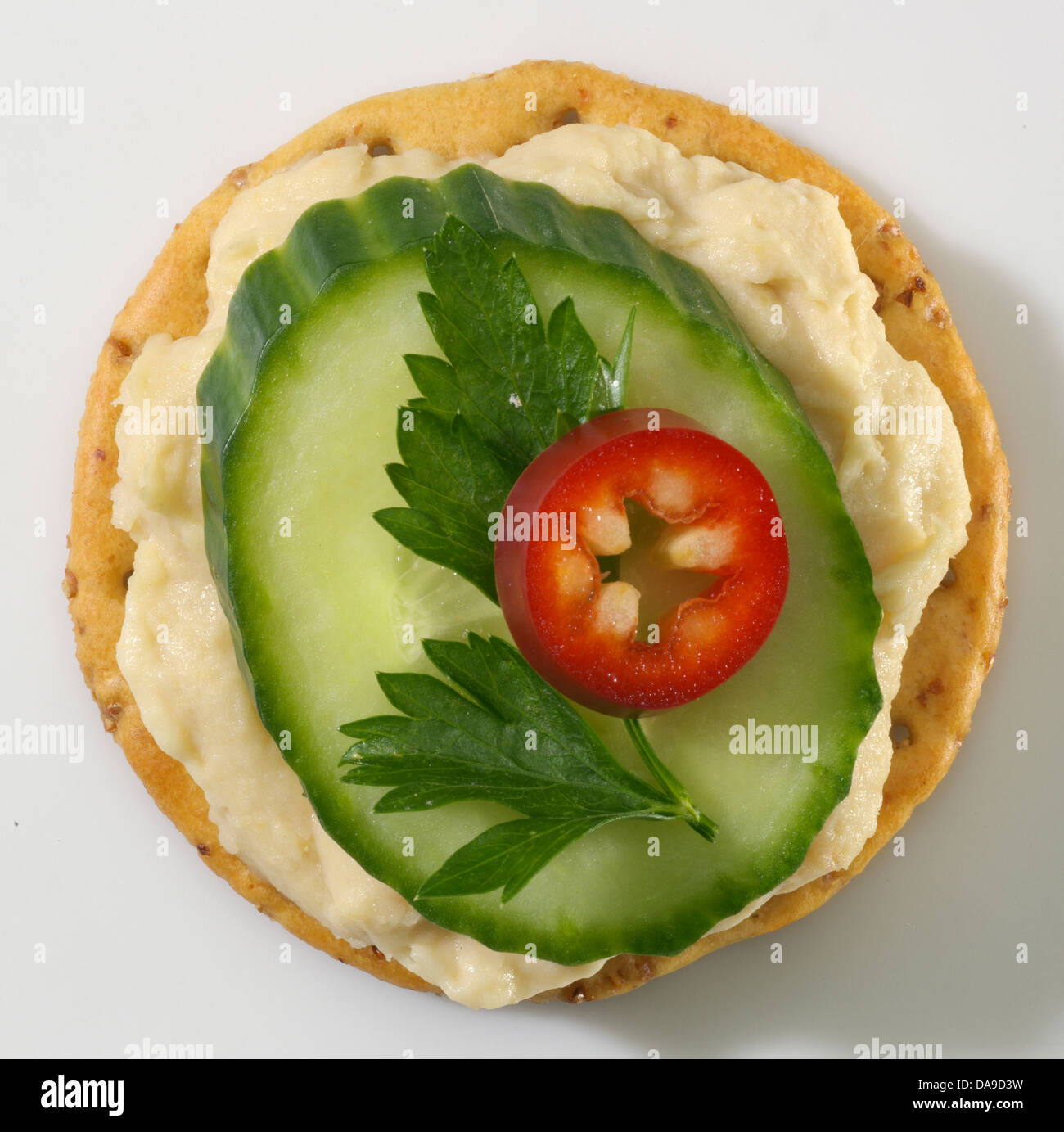 Hummus and cucumber cracker Stock Photo Alamy