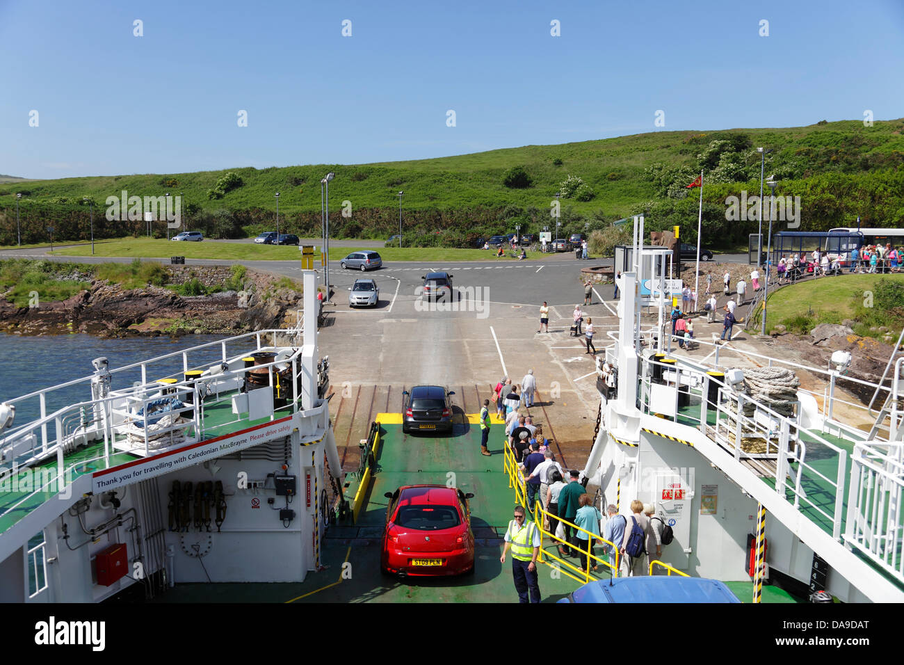 Island of Great Cumbrae, North Ayrshire, Scotland, UK, Monday, 8th July, 2013. Passengers and cars disembark a Caledonian Macbrayne Ferry in warm sunshine after sailing from the town of Largs in the Firth of Clyde Stock Photo