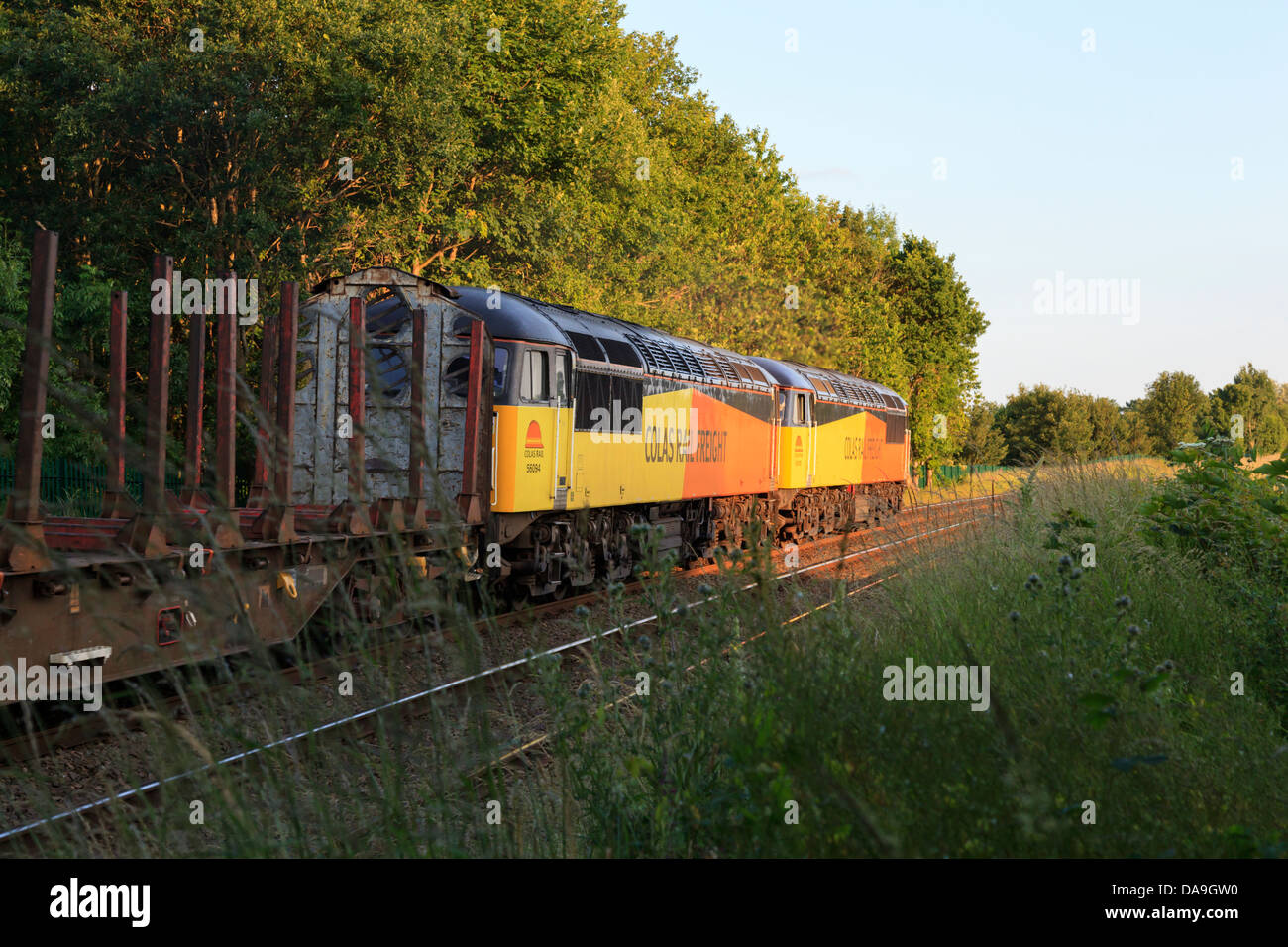 A pair of Colas liveried Class 56 (No 56105 and 56094) double head past Weston Rhyn level crossing after leaving Kronospan Stock Photo