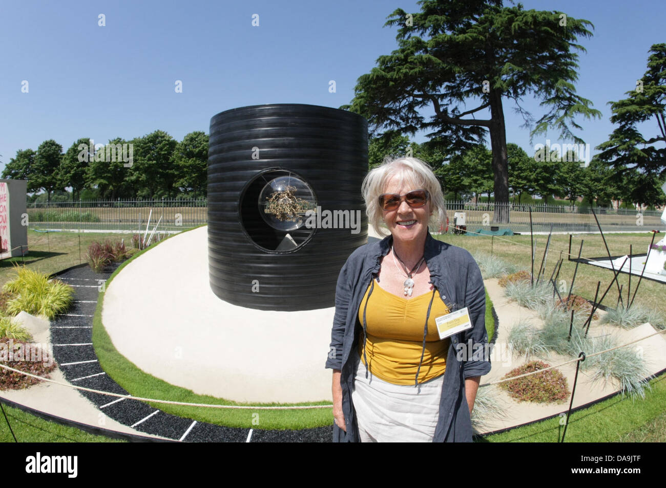 London, UK. 8th July, 2013. Falls the Shadow, Sponsored by RHS, Silver medal winner. Designed by Sheena Seeks Built by Seeks Gardens. RHS Hampton Court Palace Flower Show. Credit:  martyn wheatley/Alamy Live News Stock Photo