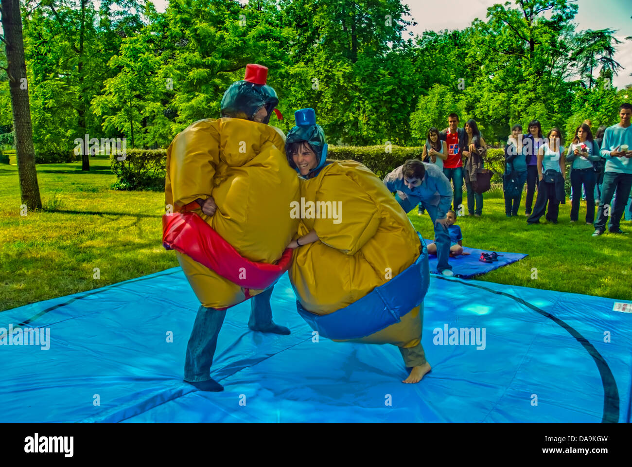 Paris, France, Group French Young People Watching Two Teenage Sumo Wrestlers in Costume, Fighting Outside adolescence Stock Photo
